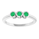 Round Emerald Three Stone Ring in Platinum