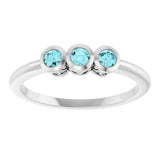 Round Blue Zircon Three Stone Ring in Platinum
