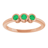 Round Emerald Three Stone Ring in Rose Gold