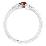 Oval Mozambique Garnet Accented Ring with Diamond Accents in Platinum