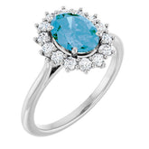 Oval Swiss Blue Topaz Halo Ring with Diamond Accents in Gold