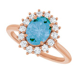 Oval Swiss Blue Topaz & Diamond Halo Ring in Gold and Platinum