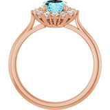 Oval Blue Zircon & Diamond Halo Ring in Gold and Platinum