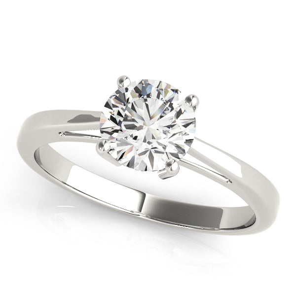 Round Cut Diamond Claw Setting Engagement Ring.