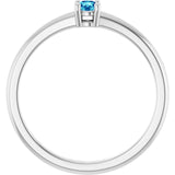Round Blue Zircon Solitaire Ring in Gold and Platinum