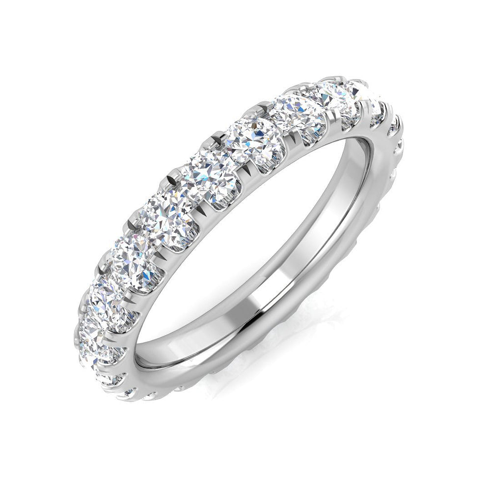 Silver ring with clear gemstones on a white background
