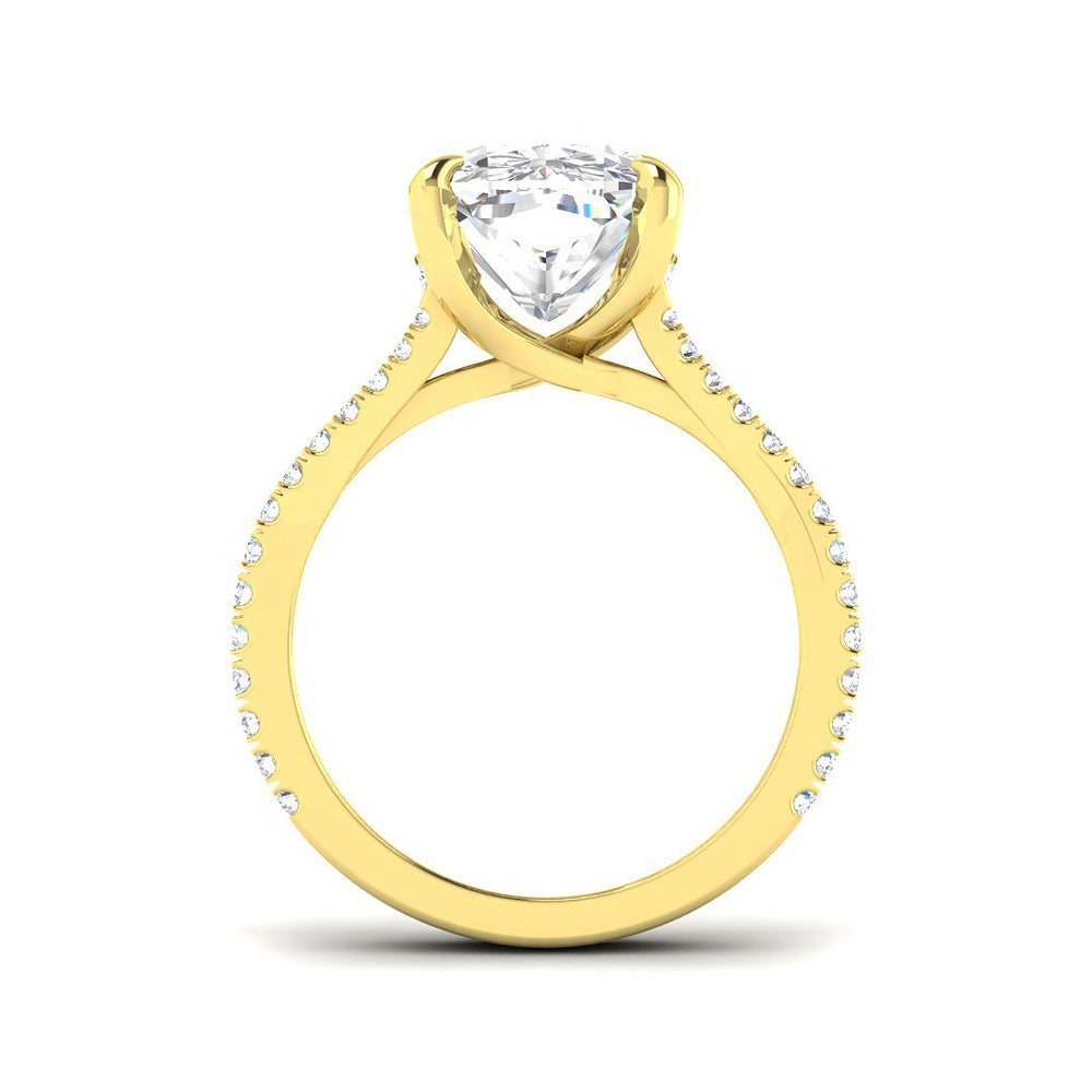 Cushion cut solitaire diamond engagement ring in yellow gold with pavé set shoulders, featuring natural diamond (F–G colour, VS–SI clarity) or lab grown diamond (D colour, VVS clarity)