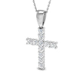 Silver cross pendant necklace on a white background