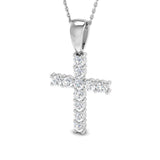 Silver cross pendant necklace on a white background