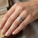 Elegant marquise cut diamond ring with pavé set shoulders