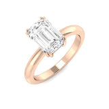 Emerald cut diamond engagement ring in rose gold with a smooth high-polish finish