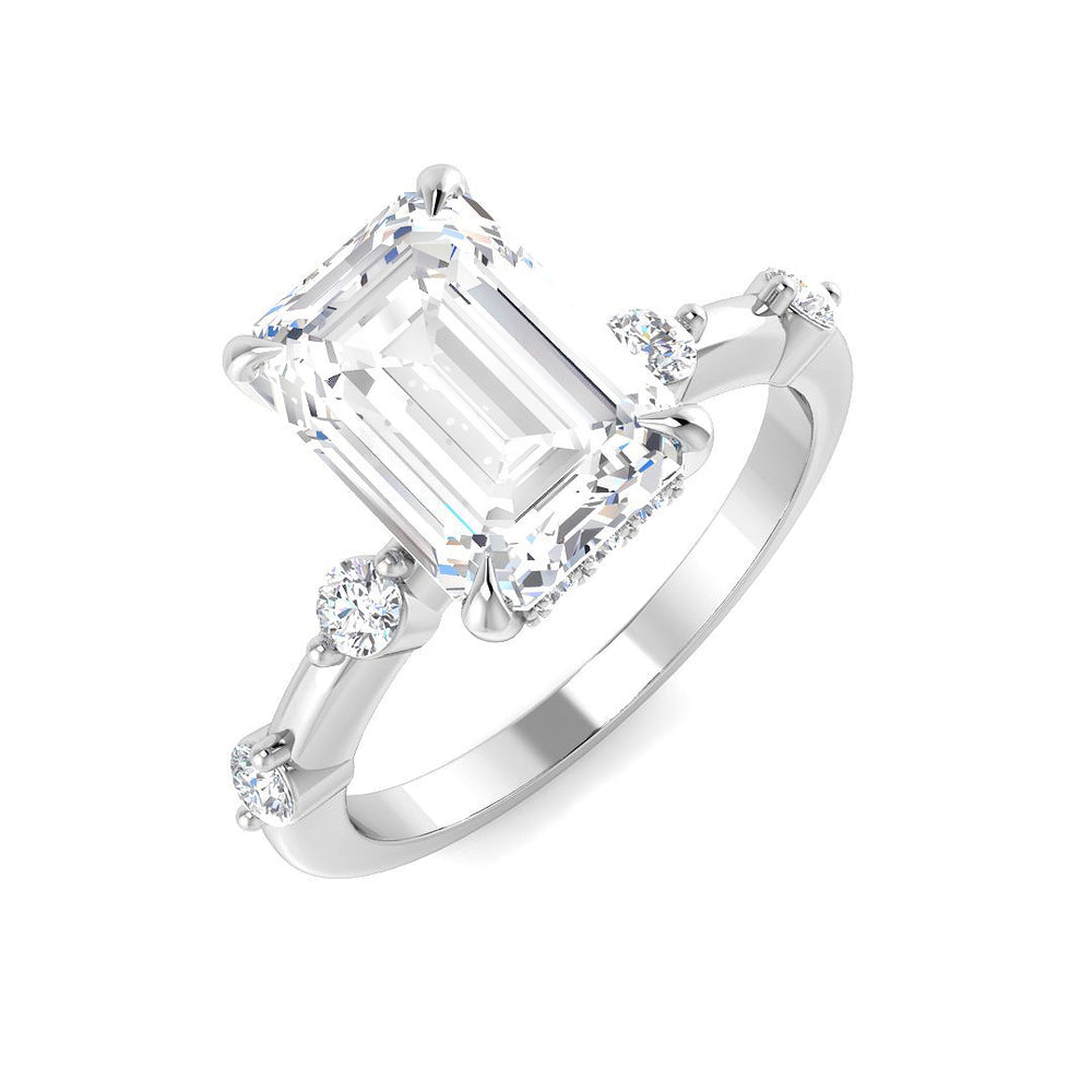 Emerald cut diamond engagement ring with side diamonds in white gold