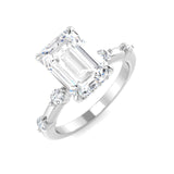 Emerald cut diamond engagement ring with side diamonds in white gold