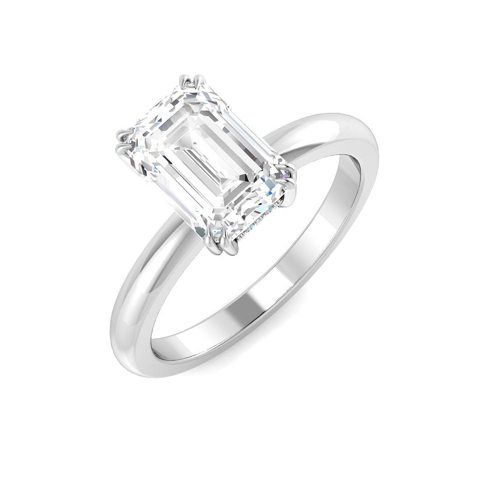 Emerald cut diamond solitaire engagement ring in white gold with a sleek polished band