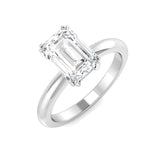 Emerald cut diamond solitaire engagement ring in white gold with a sleek polished band