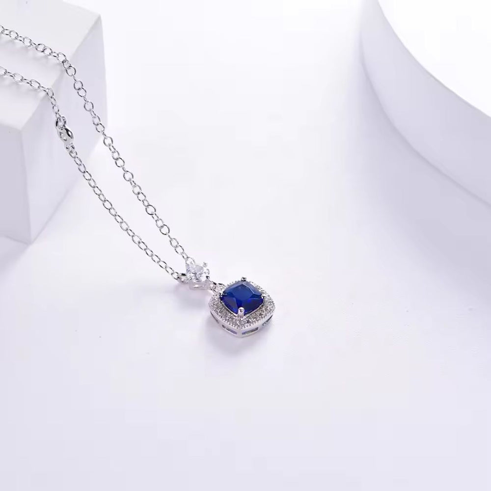 Lab Sapphire and Round Diamond Solitaire Pendant in White Gold
