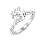 Silver ring with a large diamond and smaller diamonds on the band against a white background