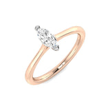 Minimal marquise diamond solitaire engagement ring in rose gold with a polished plain band