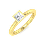 Gold ring with a diamond on a white background