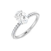 Oval cut diamond solitaire engagement ring in white gold with pavé band