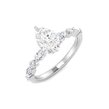 Diamond ring with a pear-shaped center stone on a white background