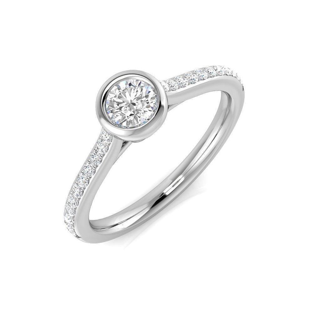 Round diamond bezel set solitaire ring with pavé band in white gold