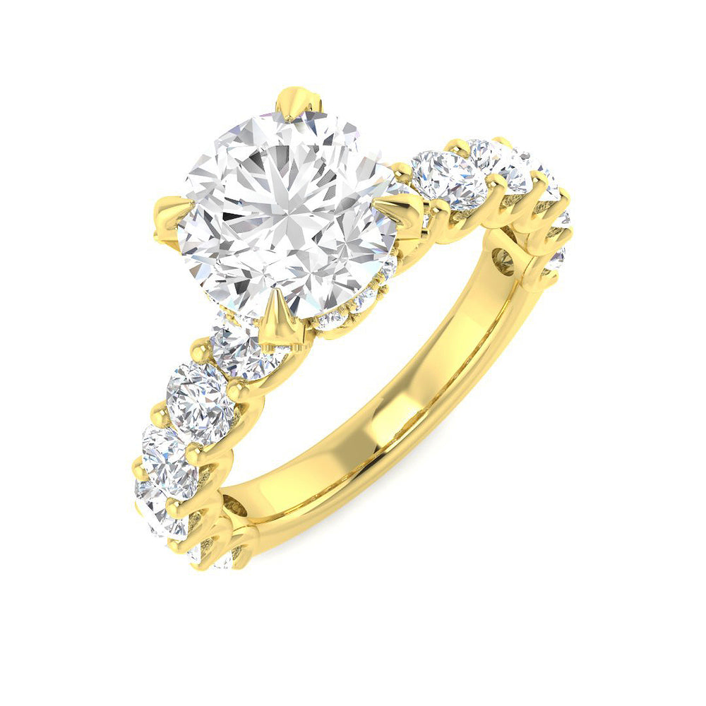 Gold ring with a large central diamond and smaller diamonds on the sides against a white background