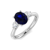 Oval Cut Blue Sapphire Trilogy Ring in Gold