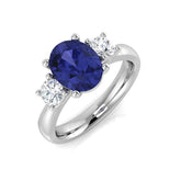 Tanzanite Three Stone Ring with Side Round Diamonds in Platinum