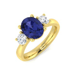 Tanzanite Three Stone Ring with Side Round Diamonds in Yellow Gold