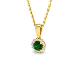 Gold pendant with a green gemstone on a white background