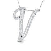 Gold initial pendant with baguette and round cut diamonds.