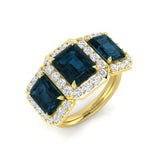 London Blue Topaz Three Stone Halo Ring in Yellow Gold