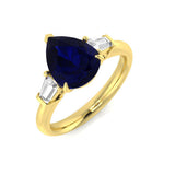 Pear Cut Blue Sapphire Three Stone Ring with Natural Baguette Side Stones | UK Hallmarked