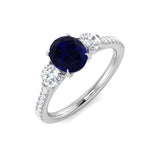 Blue Sapphire Three Stone Ring with Round Diamond Side Stones & Pave Band