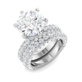 Round diamond engagement ring with triple row pavé band in white gold