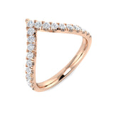 Rose gold ring with diamond accents on a white background