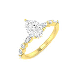 Gold ring with pear-shaped diamond on a white background