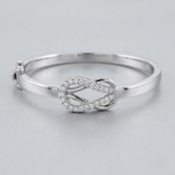 Bracelet de tennis de luxe en or et platine, serti de diamants ronds.