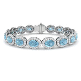 Oval Aquamarine and Natural Round Diamond Halo Tennis Bracelet in 18K White Gold