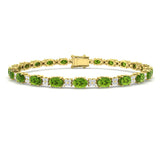 9K Yellow Gold Tennis Bracelet in Prong-Set Oval Cut Peridot and Natural Diamonds