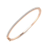 Bracelet de tennis de luxe en or et platine, serti de diamants ronds.