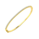 Bracelet de tennis de luxe en or et platine, serti de diamants ronds.