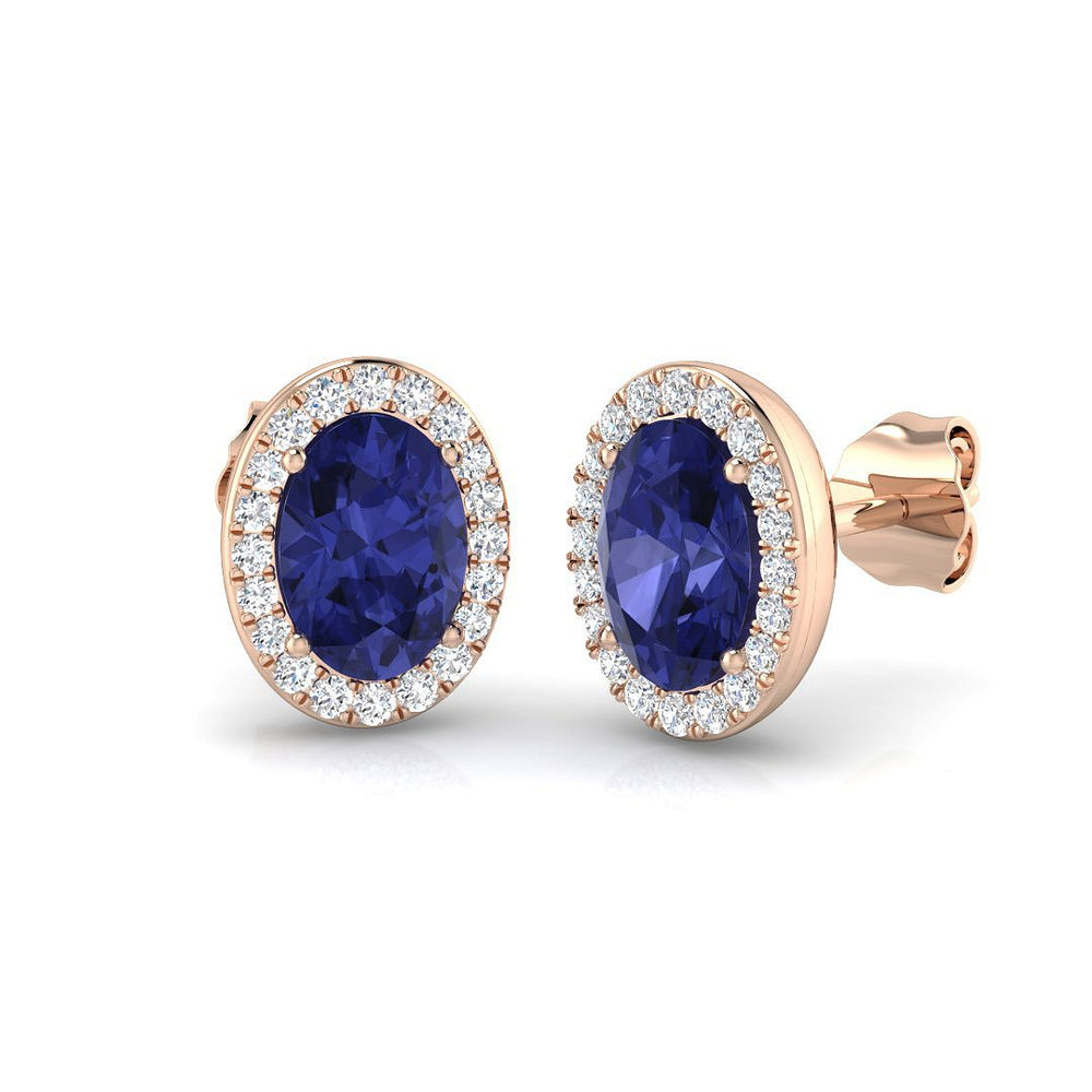 Oval Tanzanite Halo Stud Earrings with Natural Diamonds - Push Back design featuring stunning blue tanzanite stones.