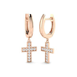 Rose gold hoop earrings with cross pendants on a white background