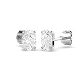Pair of diamond stud earrings on a white background