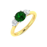 Emerald Solitaire with Round Side Stone Ring in White Gold