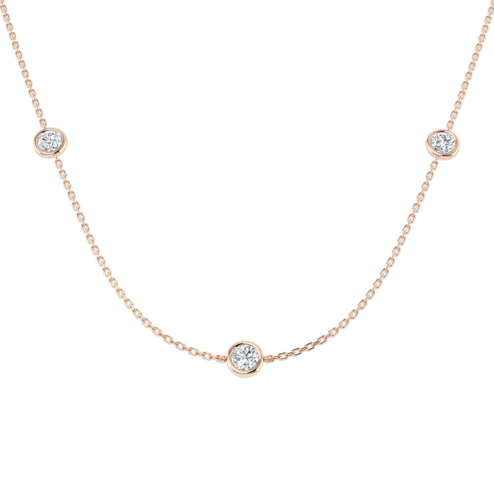 Rose gold necklace with small round diamonds on a white background