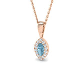 Rose gold necklace with a blue gemstone pendant on a white background