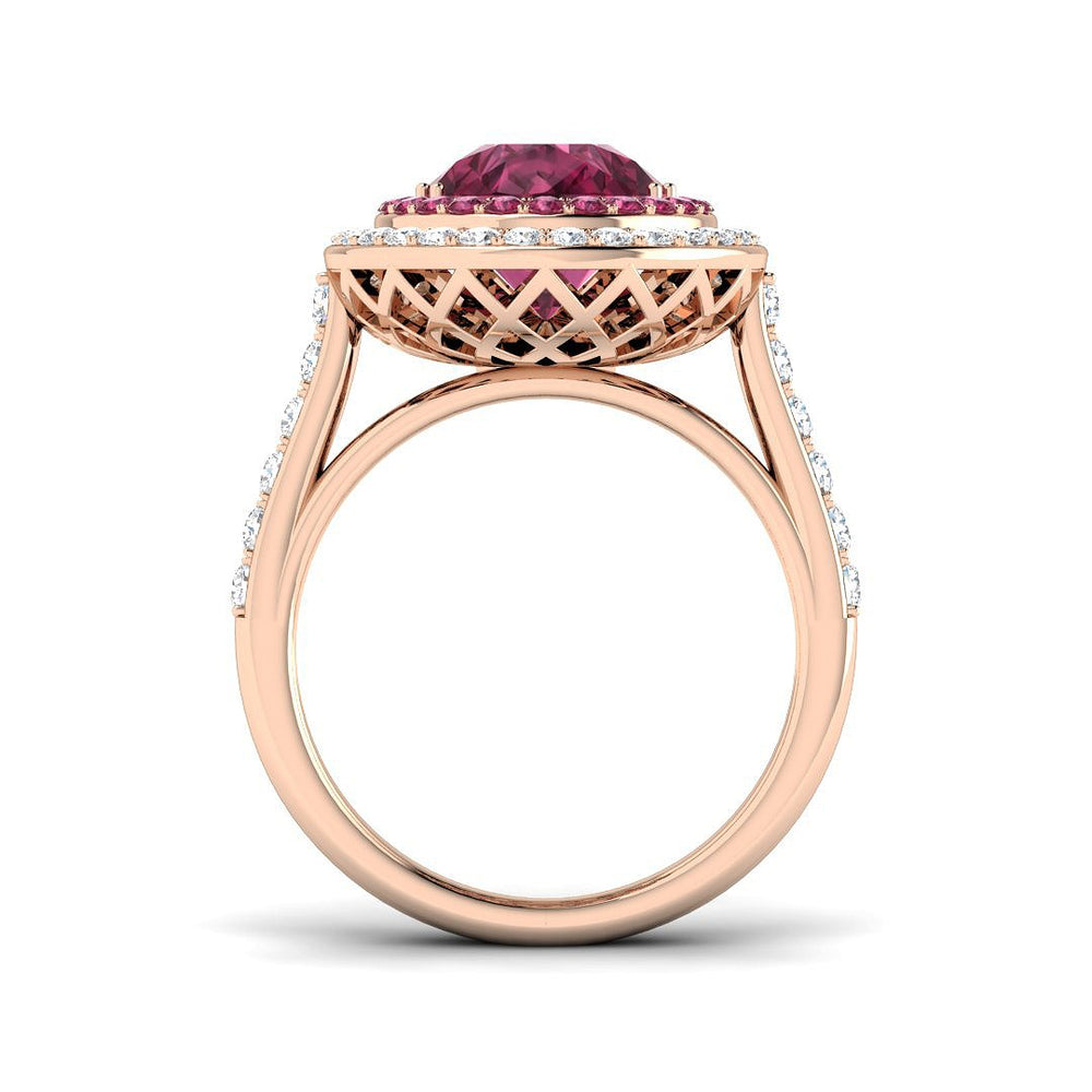 Pink Tourmaline Halo Ring with a pear cut center stone and diamond pavé, showcasing vintage elegance and luxury.